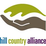 Logo with a leaf and hand and the words hill country alliance in blue, green, and purple