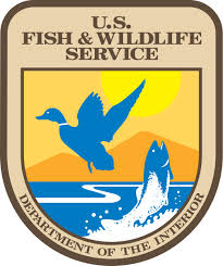 Logo of a badge with a duck, and the words U.S. Fish & Wildlife Service, Department of the Interior
